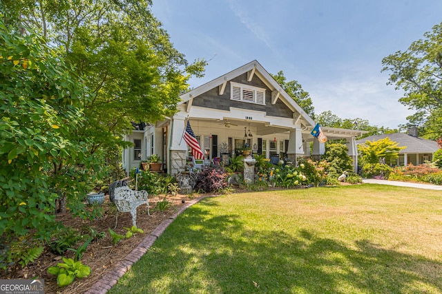 craftsman inspired home featuring ceiling fan and a front yard