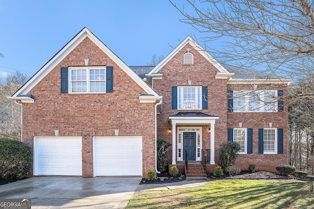 view of front facade with brick siding, driveway, a front yard, and a garage