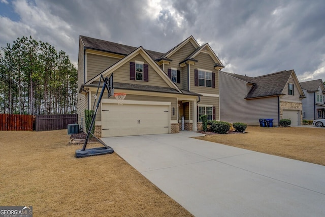 craftsman inspired home with central AC unit, a garage, brick siding, fence, and driveway