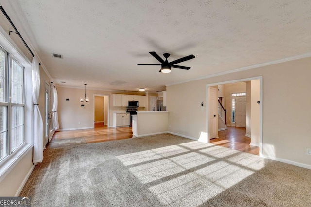 unfurnished living room featuring light carpet and crown molding