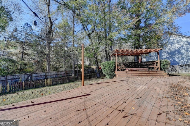 wooden terrace with fence and a pergola