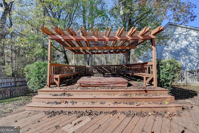 deck with fence and a pergola