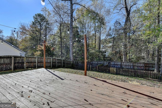 deck featuring a fenced backyard