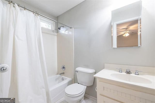 bathroom featuring toilet, shower / bath combo, and vanity