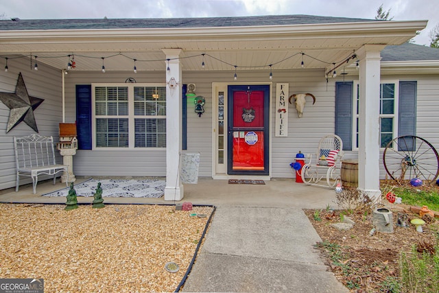 entrance to property featuring covered porch