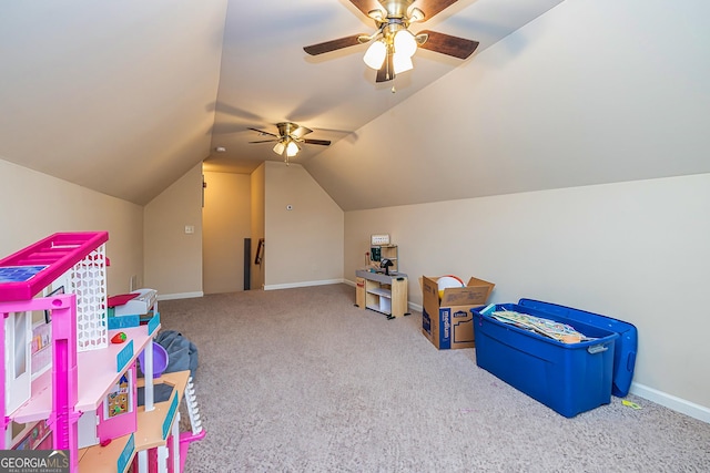 recreation room featuring a ceiling fan, baseboards, vaulted ceiling, and carpet flooring