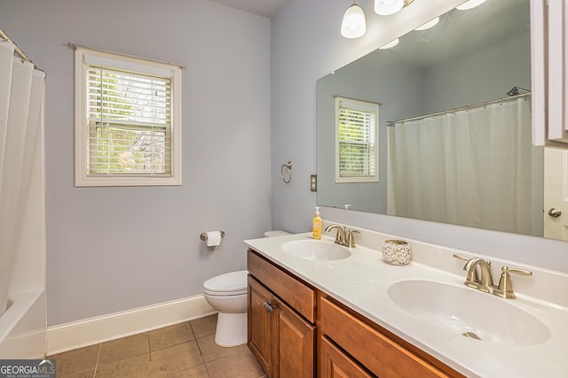 full bath featuring tile patterned flooring, toilet, a sink, and baseboards