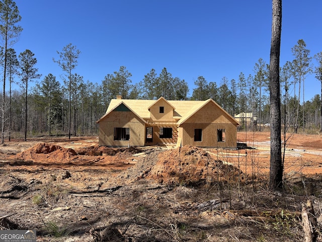 property in mid-construction with a chimney