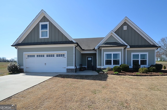 craftsman-style home with driveway, a garage, board and batten siding, and roof with shingles