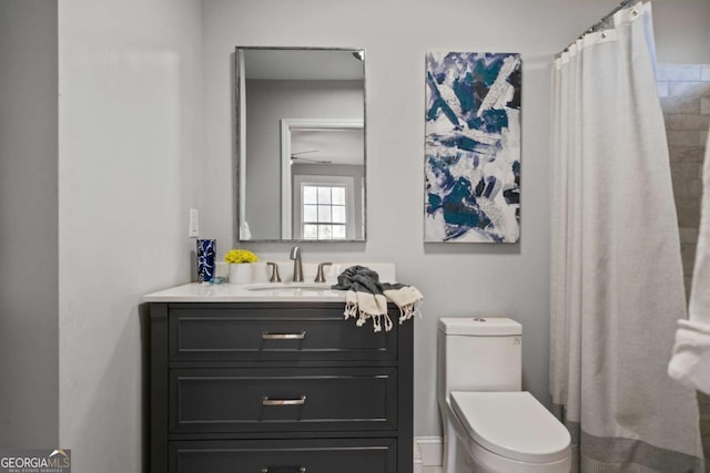 full bathroom with toilet and vanity