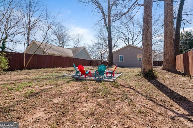 view of yard featuring a patio area and a fenced backyard