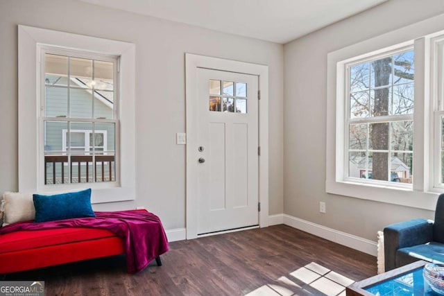 entryway featuring wood finished floors and baseboards