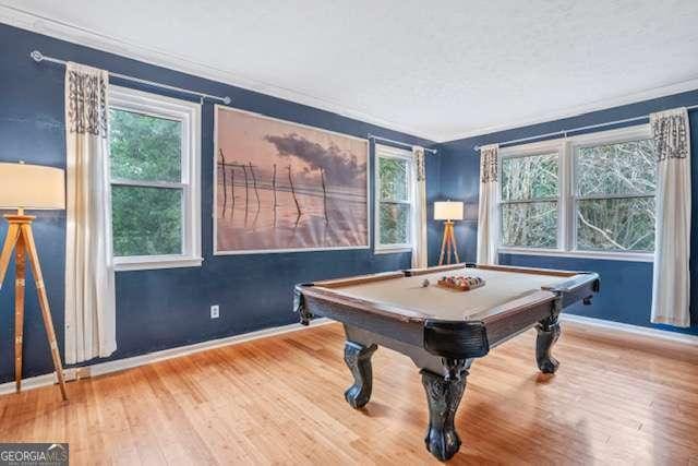 rec room featuring baseboards, ornamental molding, wood finished floors, and pool table