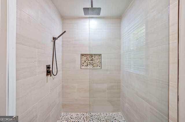 bathroom with tiled shower