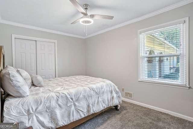 bedroom with carpet floors, baseboards, and ornamental molding