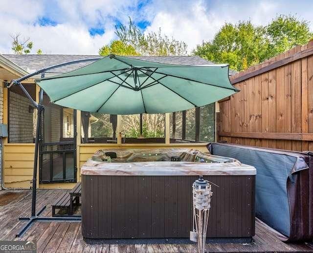 view of patio with a hot tub and a wooden deck