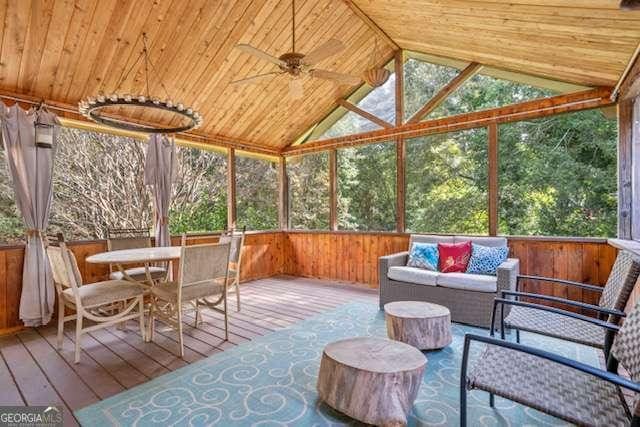 sunroom with vaulted ceiling, wood ceiling, and a ceiling fan