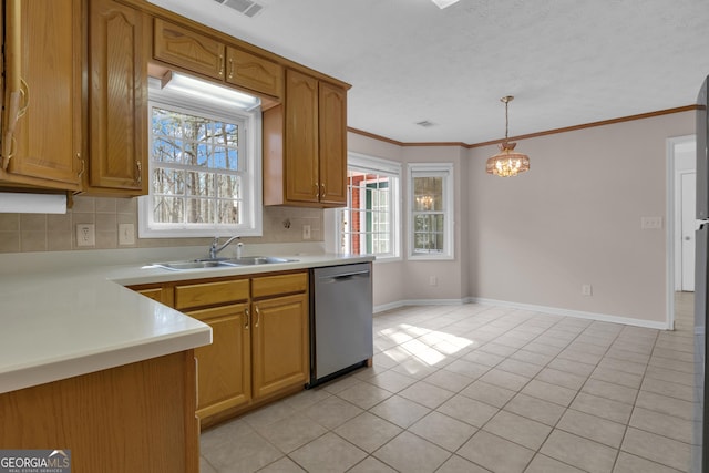 kitchen with crown molding, light countertops, backsplash, stainless steel dishwasher, and a sink