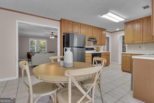 clothes washing area featuring washer and dryer, laundry area, and light tile patterned floors