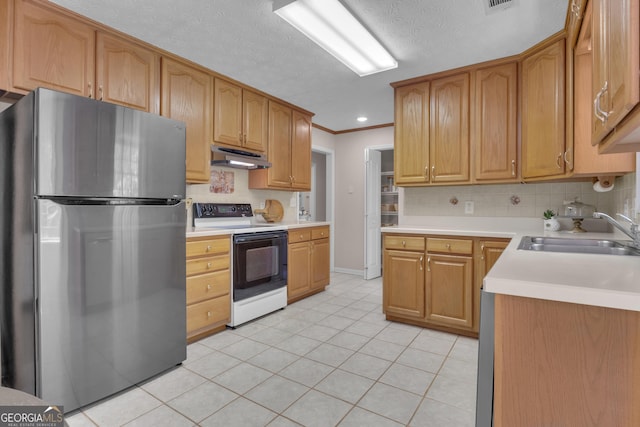 81 Bowers Rd, Moreland, GA 30259 - kitchen featuring range with electric cooktop, freestanding refrigerator, a sink, under cabinet range hood, and light tile patterned flooring