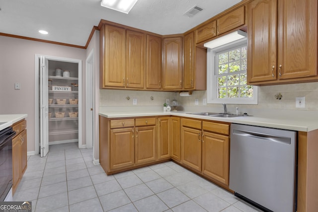 81 Bowers Rd, Moreland, GA 30259 - kitchen with stainless steel dishwasher, a sink, backsplash, light countertops, and light tile patterned flooring