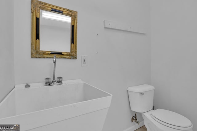 bathroom with a sink and toilet