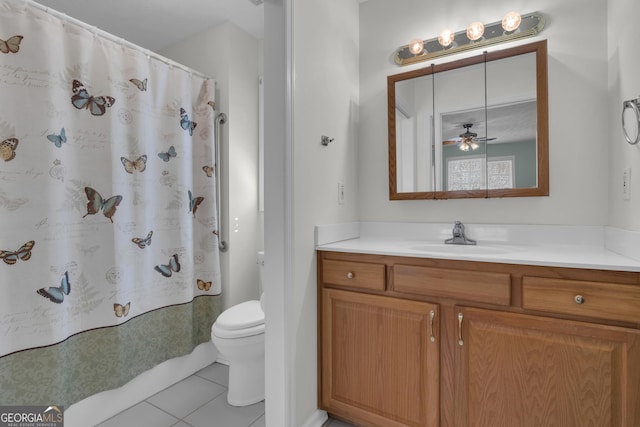 full bathroom featuring curtained shower, vanity, toilet, and tile patterned floors