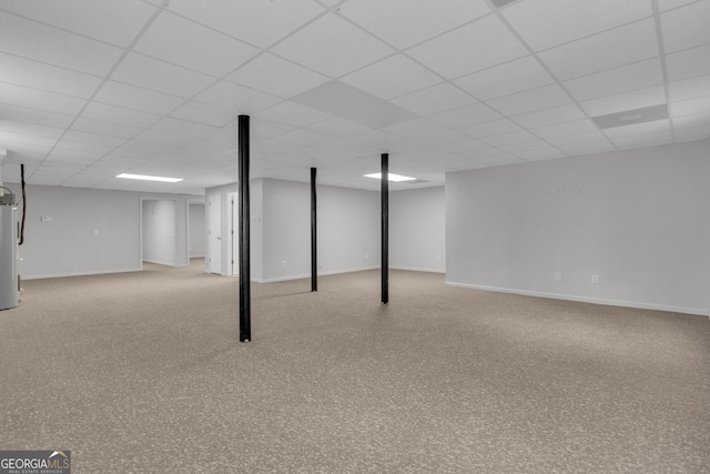 81 Bowers Rd, Moreland, GA 30259 - finished below grade area with a paneled ceiling, water heater, and baseboards