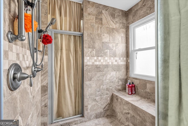 bathroom featuring a shower stall