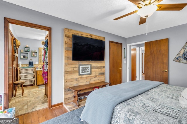 bedroom featuring a ceiling fan and light wood finished floors