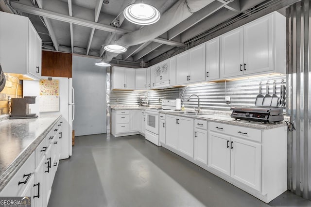 kitchen featuring a sink, finished concrete flooring, white cabinets, and white range with electric cooktop