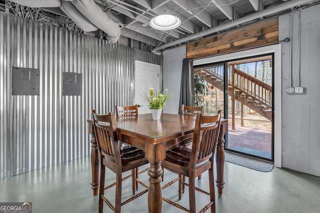 dining space with finished concrete floors