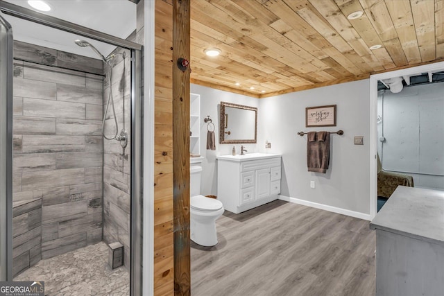 full bathroom with toilet, wood ceiling, wood finished floors, vanity, and a shower stall