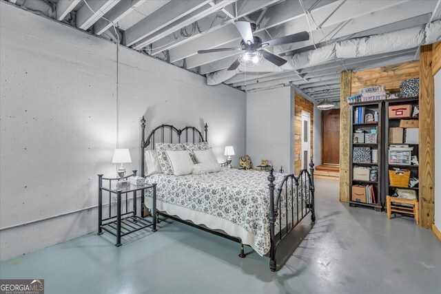 bedroom featuring finished concrete flooring