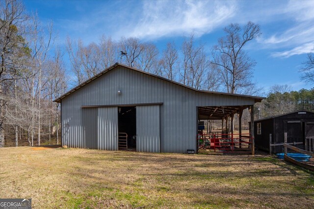 view of pole building with a yard