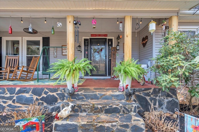 doorway to property with a porch