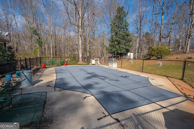 view of pool with a patio, fence, and a fenced in pool