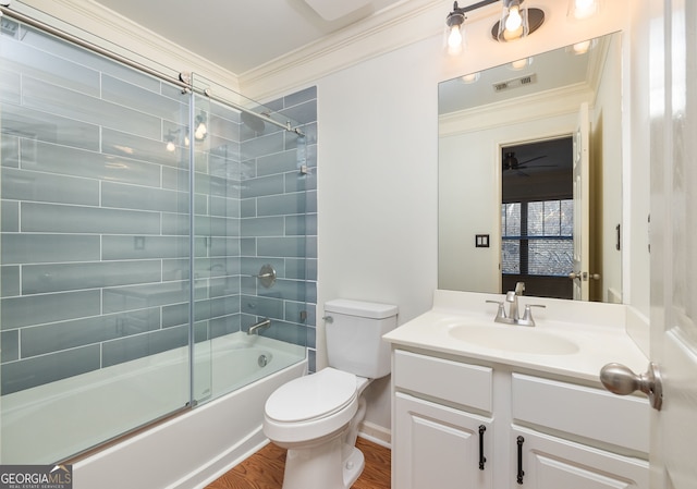 full bathroom featuring visible vents, crown molding, vanity, and toilet