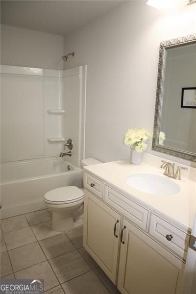 full bathroom featuring toilet, tile patterned floors, shower / bathing tub combination, and vanity