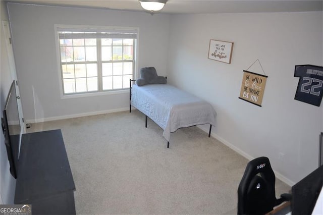 carpeted bedroom with baseboards