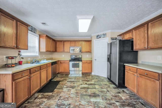 kitchen featuring visible vents, appliances with stainless steel finishes, and brown cabinets