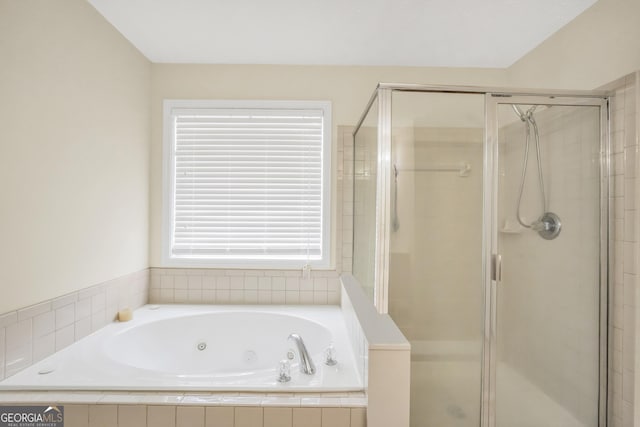 full bath featuring a stall shower and a jetted tub