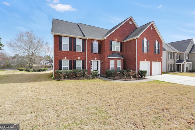 view of front facade with a garage, brick siding, driveway, and a front lawn