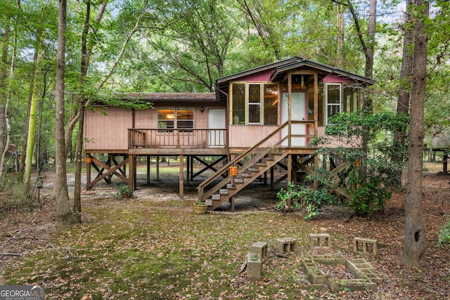 view of front of property with stairway and a wooden deck