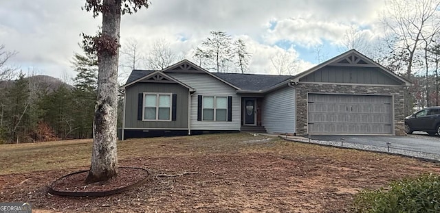 view of front of home featuring stone siding, aphalt driveway, board and batten siding, and an attached garage