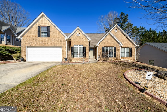 view of front of home featuring a garage, driveway, and brick siding