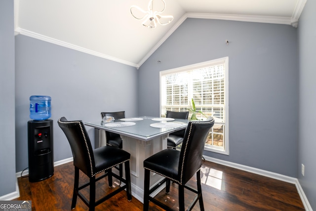 dining area with dark wood-type flooring, crown molding, and baseboards