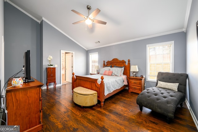 bedroom with wood finished floors, visible vents, baseboards, vaulted ceiling, and crown molding