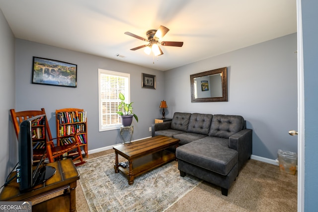 carpeted living area with ceiling fan, visible vents, and baseboards