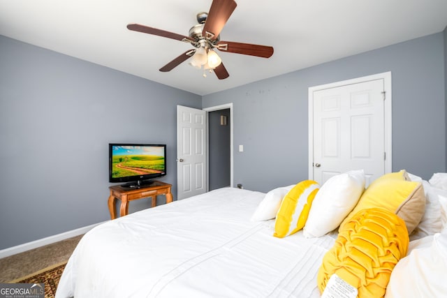 bedroom with carpet floors, baseboards, and a ceiling fan